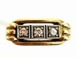 an image of a gold and silver ring with three diamonds