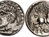 a silver coin with an image of a man on a horse