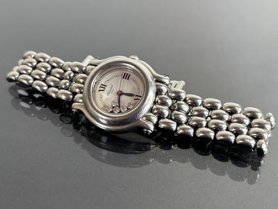 an image of a close up of a wrist watch on a table
