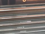 an image of a metal tool box with a laptop on top of it