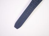 a watch that is laying on a white surface