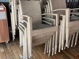 a lot of chairs that are sitting on a wooden floor