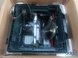 a box with a motor inside of it on the floor