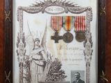 an old picture of a framed picture of a military medal