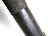 a close up view of a flashlight on a white surface