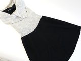 a black and white dress that is on a table