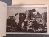 an old photo of a castle in the middle of a book