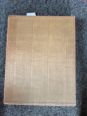 a cardboard box on the floor next to a pair of shoes