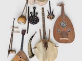 several musical instruments are arranged on a white surface
