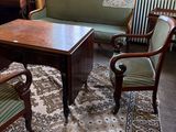 an image of a living room with couches and a table