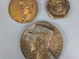three different types of coins are shown on a white surface