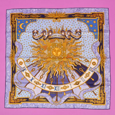 a square scarf with a sun and stars on it