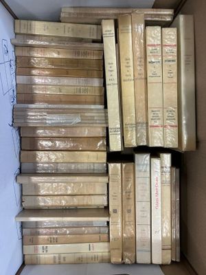 a box full of books sitting on top of a table