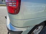 a close up of the rear end of a small van