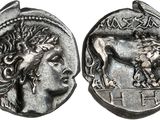 a silver coin with an image of a woman and a lion on it