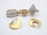 three pairs of gold and silver rings and a ring with diamonds