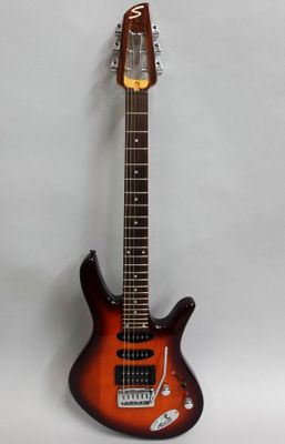 a close up of an electric guitar on a white background