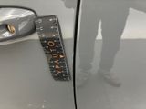 a sticker on the door handle of a car