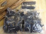 a bag of screws and screws sitting on a table