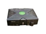 a close up of a black box with a green sticker on it