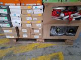 several boxes of shoes are stacked on a carton in a warehouse
