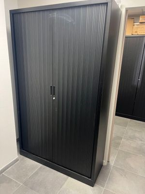 an image of a black metal cabinet in a bathroom