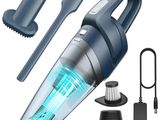 un gros plan d'un aspirateur muni d'une brosse et d'autres accessoires