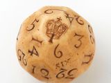 a wooden dice with numbers on it on a white surface