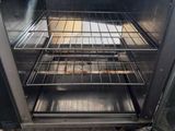 an oven that has a lot of food inside of it