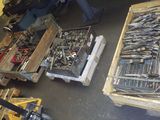 many tools on pallets in a warehouse area