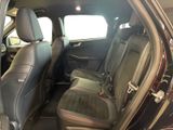 the back seats of a car with a black leather seat cover