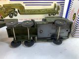 a toy train with a truck on the front and a box on the back