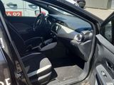 a car with the door open and the driver ' s seat up