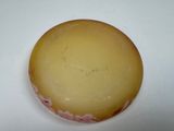 a piece of cheese that is sitting on a table