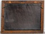 an old wooden frame with a blackboard attached to it