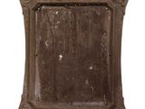 an old mirror that is hanging on the wall