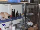 a metal shelving with many items on it in a room