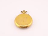 an image of a gold pocket watch on a white surface