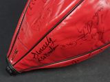 a red umbrella with a lot of writing on it
