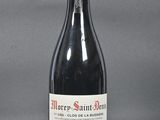 a bottle of wine that is sitting on a table
