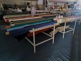 a room filled with lots of different types of fabrics