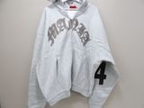 grey hoodie with the number 4 on it hanging on a wall