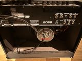 a guitar amp sitting on a table with a speaker in it
