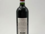 a bottle of wine that is sitting on a table