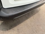 a close up of the bumper of a white car