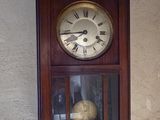a clock hanging on the wall of a house