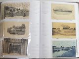 an open book with pictures of boats and buildings on the pages