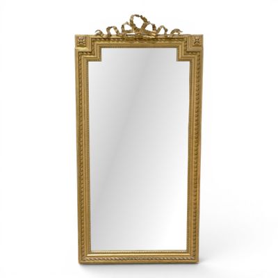 a gold framed mirror on a white background