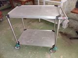 a metal cart that is sitting on the floor