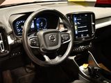 the interior of a car with a steering wheel and dashboard controls